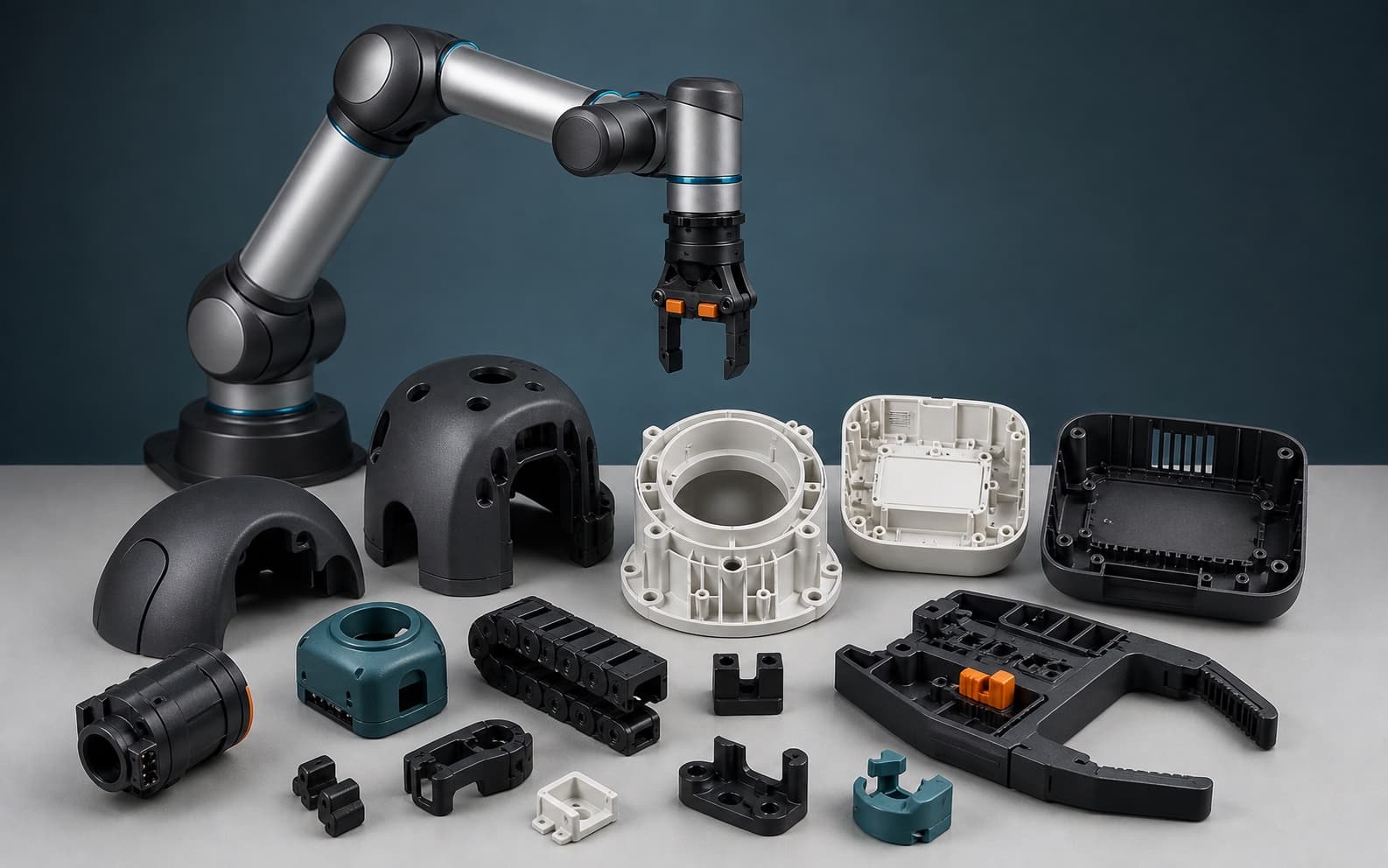 Concept composition of a robot arm with injection-molded covers, housings, cable guides and gripper components
